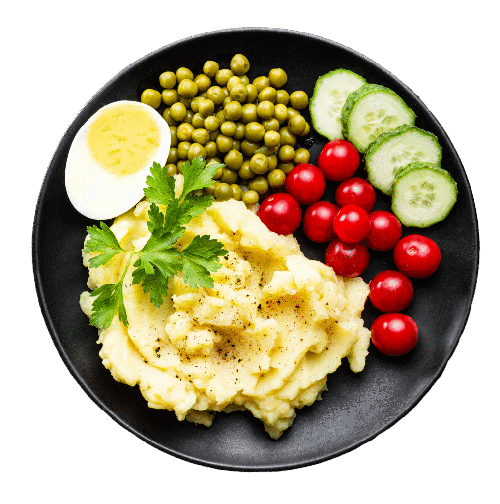 Ausgewogenes Kitaessen mit Kartoffelpüree, Erbsen, Kirschtomaten, Gurke und gekochtem Ei – geliefert von Aubergine & Zucchini in Meckenheim